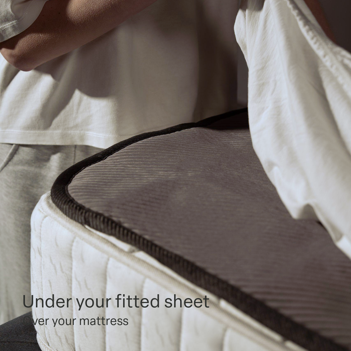 The Qimora Pad fitted over the mattress, under the fitted sheet
